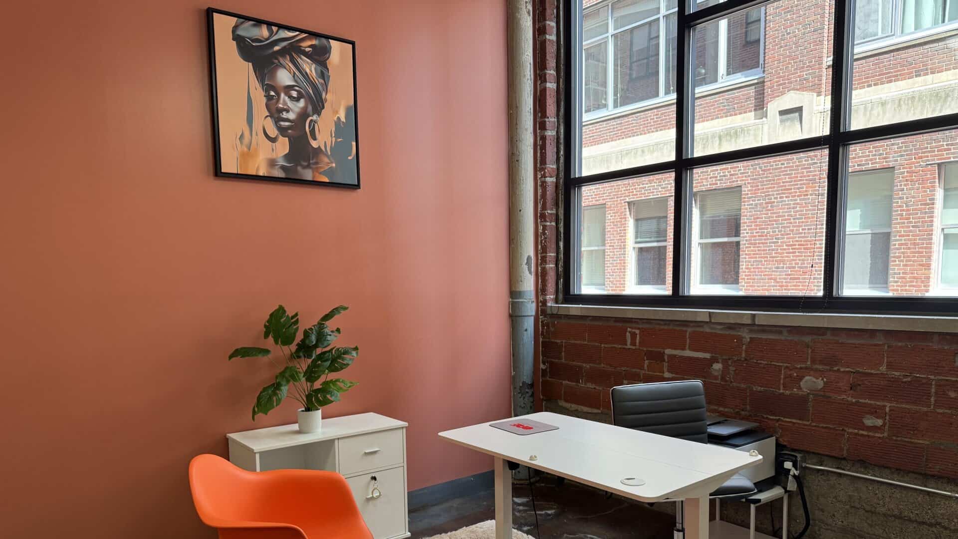 a photo of an office desk and chairs